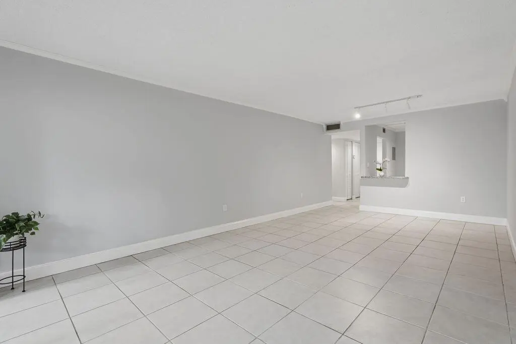 Travis long living room to kitchen at 485 N PINE ISLAND Road A105, Plantation