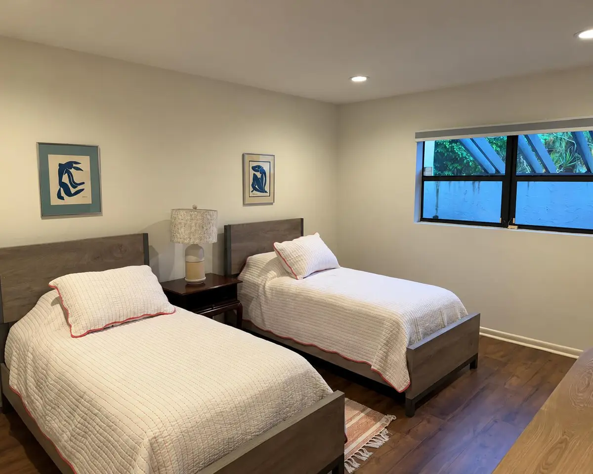 Minimal Twin Bedroom with Blue Artwork at 21708 TALL PALM Circle 7-A, Boca Raton