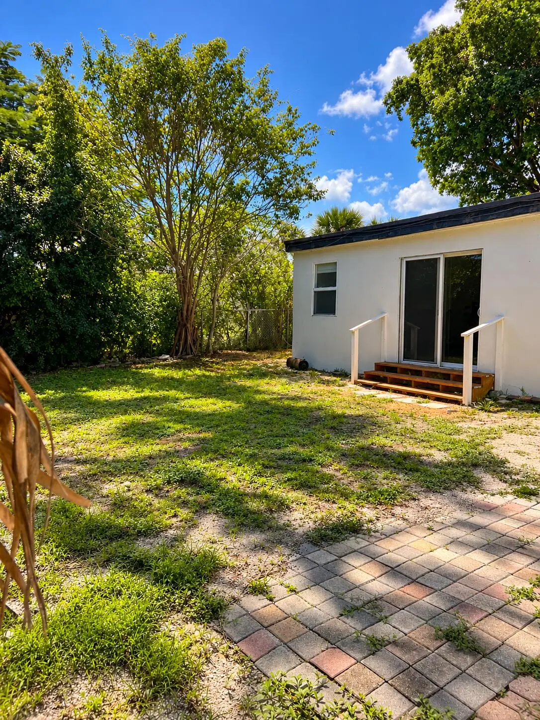 Sunny Backyard with White Garden Additio at 5260 NE 16TH Avenue, Pompano Beach