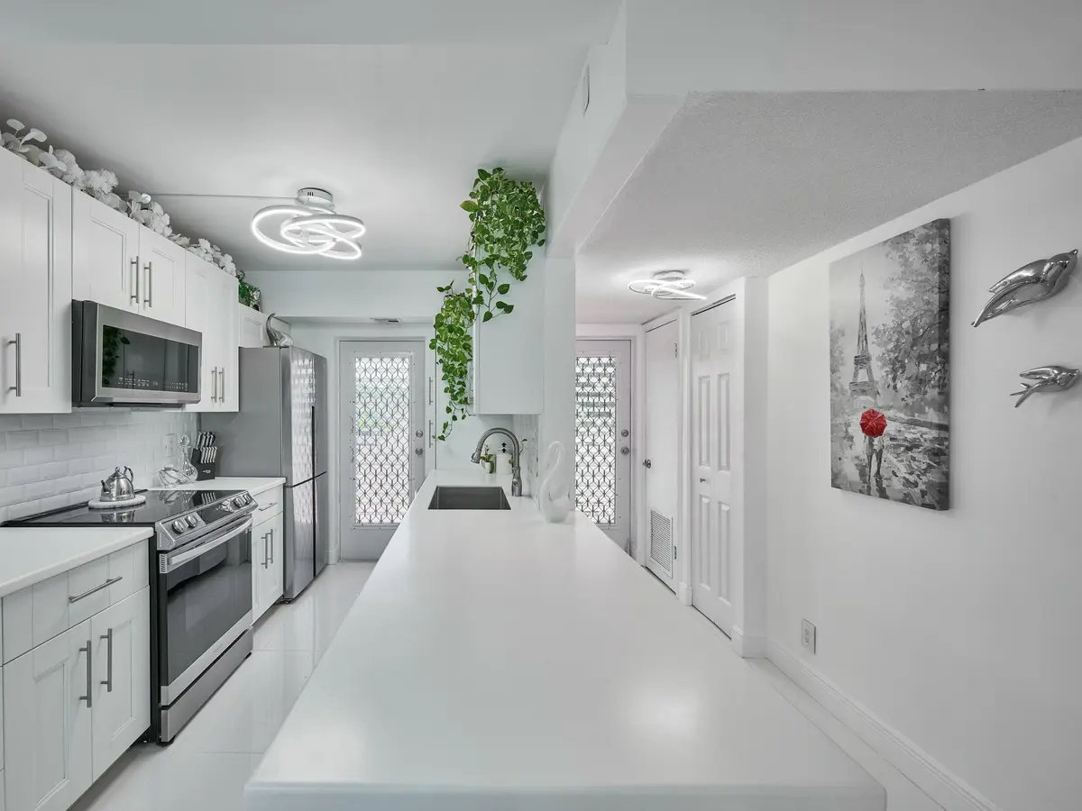 Entry & Kitchen at 3421 Spanish Trail 330, Delray Beach