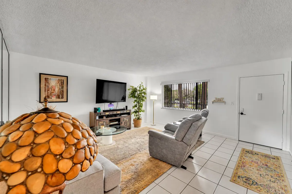 Modern Living Room with Amber Pebble Lam at 7342 ASHMONT Circle 203, Tamarac