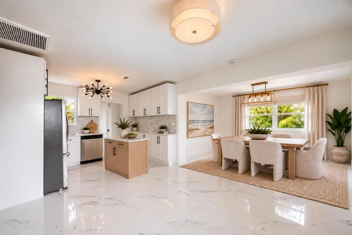 3370 kitchen cabinet island and dining r at 3370 NW 9th Street, Lauderhill
