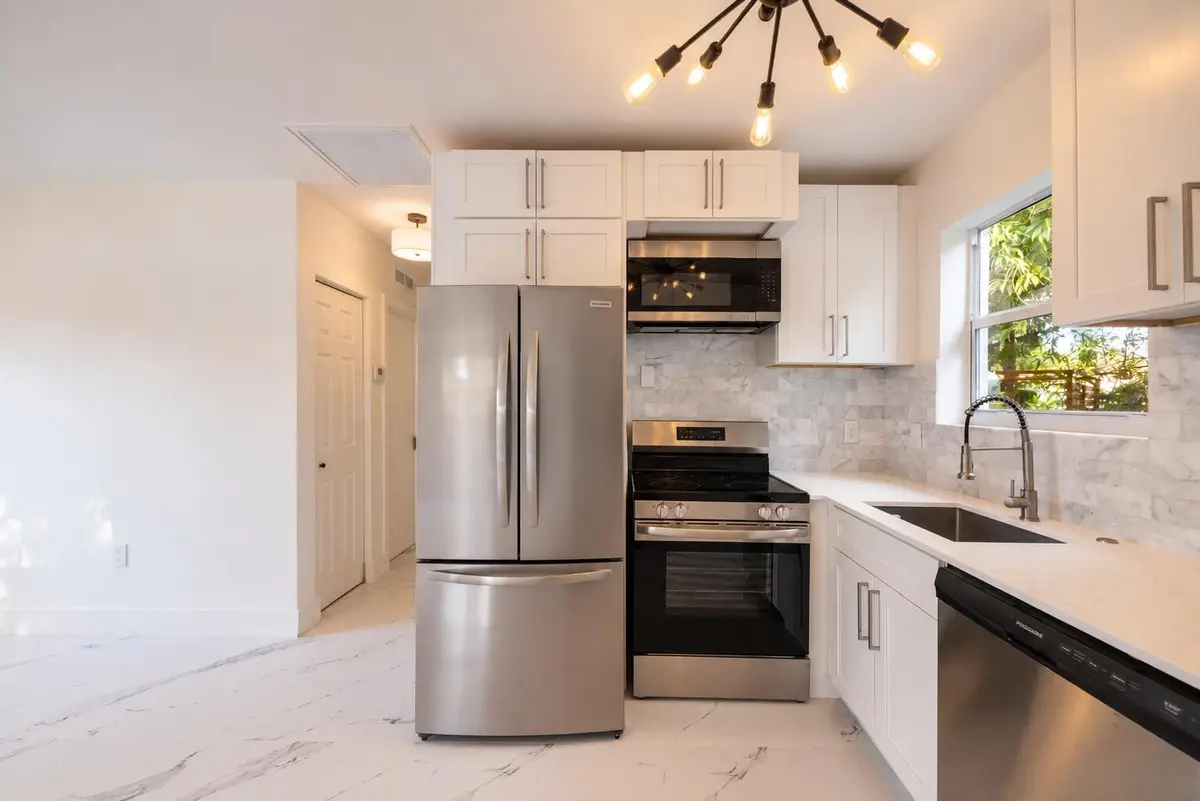 3370 kitchen fridge shot light on at 3370 NW 9th Street, Lauderhill