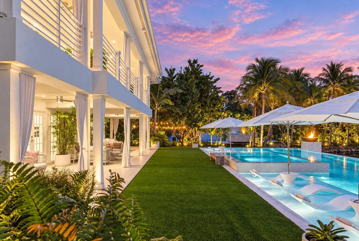 Luxury poolside estate at twilight at 13920 Stirling Road, Southwest Ranches