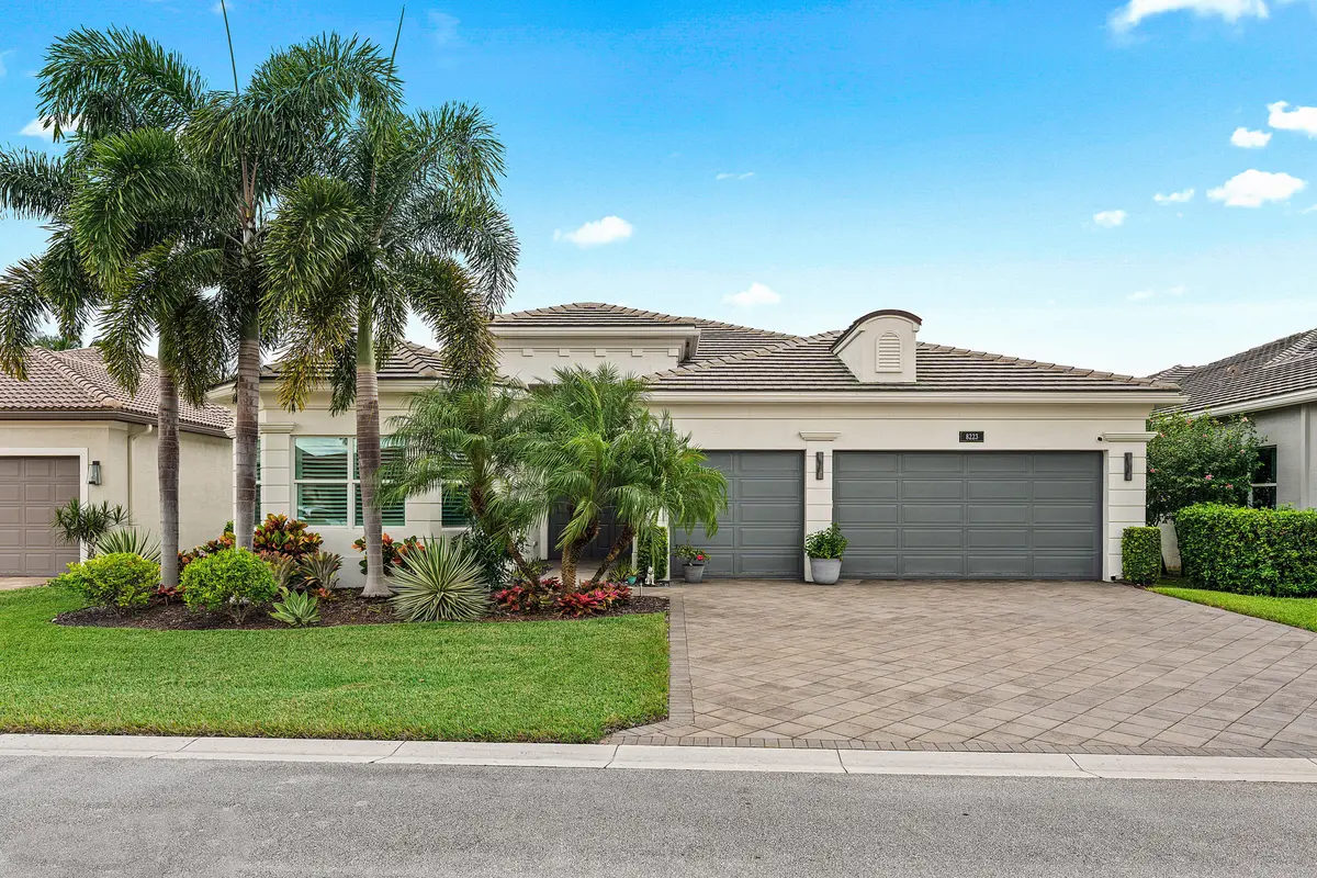 Lushly Landscaped Exterior at 8223 Majestic Mountain Drive, Boynton Beach