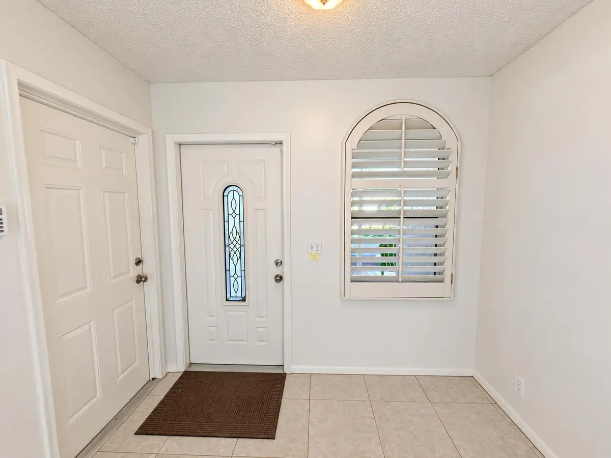 Brightened front entry, faithfully prese at 6309 DUSENBURG Road, Delray Beach