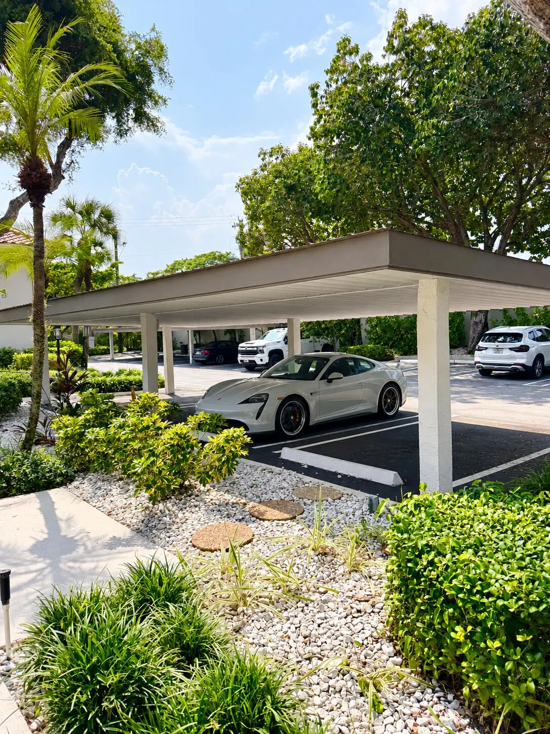 Sunny Tropical Condo Carport with Sports at 40 Pelican Pointe Drive 205, Delray Beach