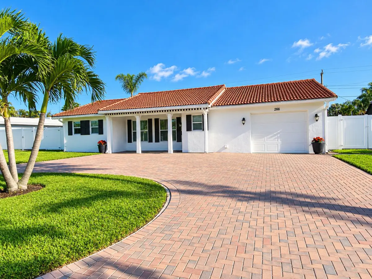0Sunny Palm-Framed Suburban Home at 266 SW 12TH Street, Boca Raton