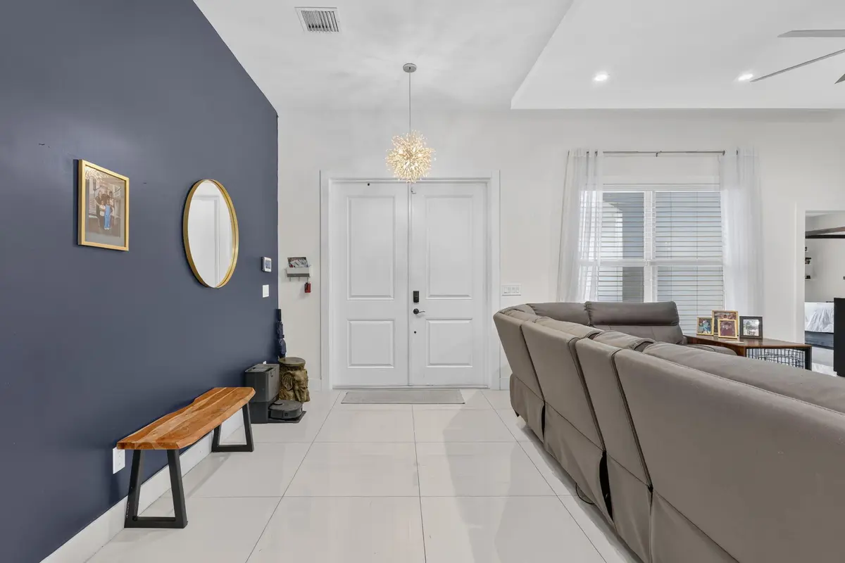entryway with modern chandellier at 2865 SW Rosser Boulevard, Port St. Lucie
