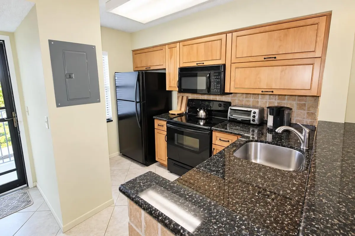 Modern Galley Kitchen at 2230 N CYPRESS BEND Drive 410, Pompano Beach