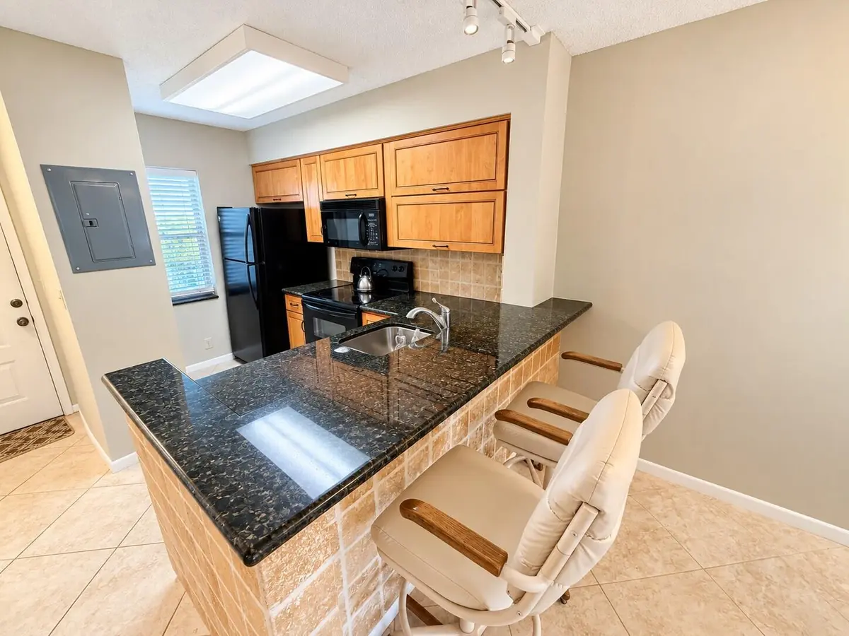 Modern Kitchen with Breakfast Bar at 2230 N CYPRESS BEND Drive 410, Pompano Beach