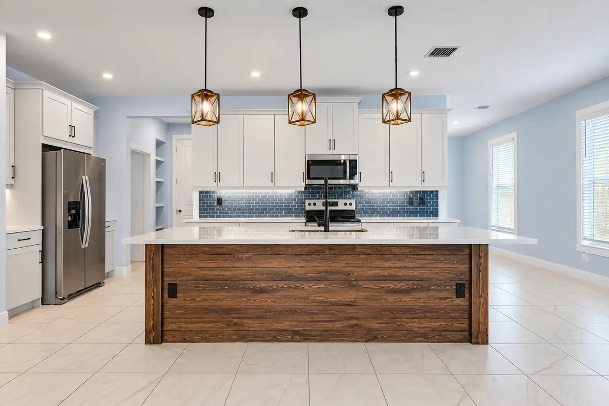 Modern Kitchen with Warm Pendant Lights at 3524 NW SOLANGE Court, Jensen Beach
