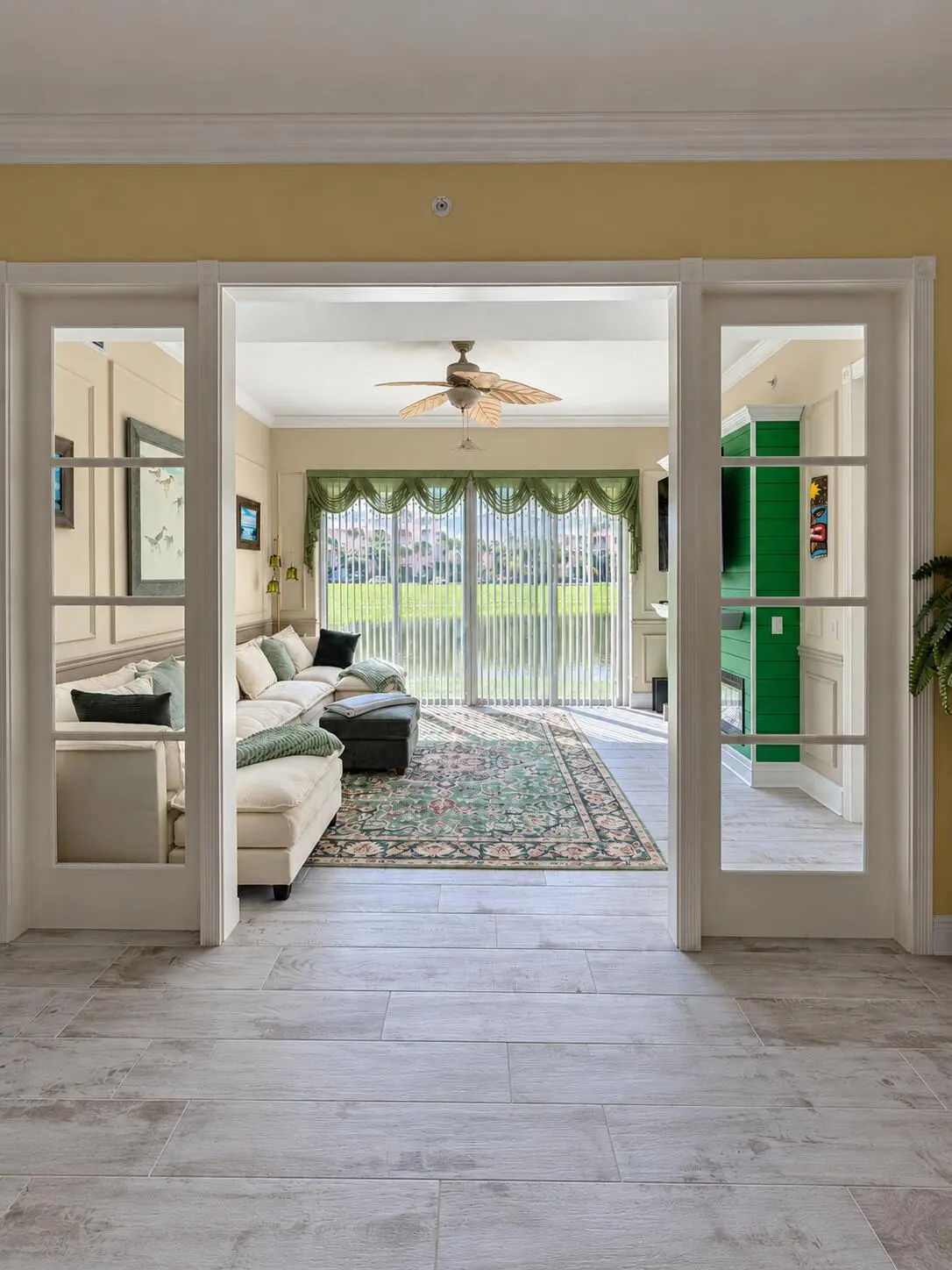 Bright Sunroom Living Area at 2 HARBOUR ISLE Drive 101, Fort Pierce