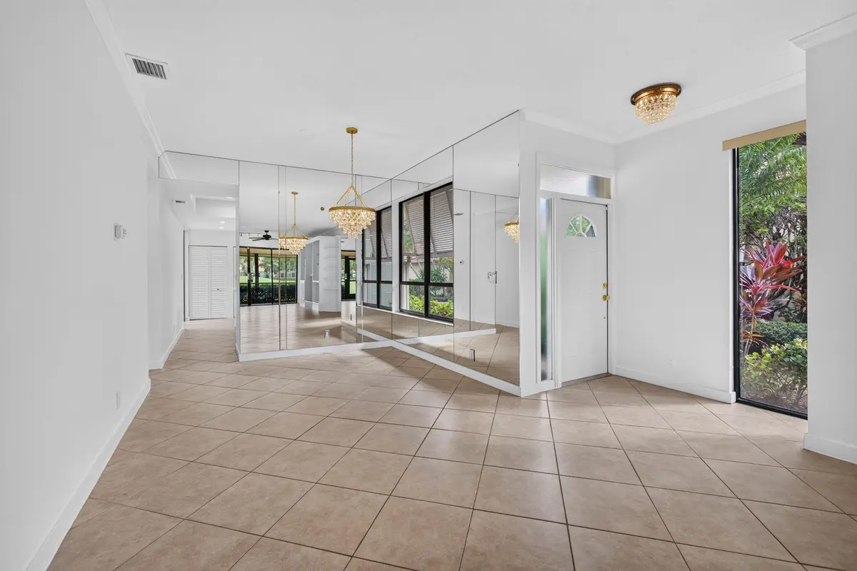 04 - Entry and dining area at 287 OLD MEADOW Way, Palm Beach Gardens