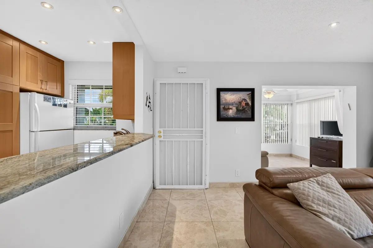 interior entrance with custom screen doo at 702 South Drive A, Delray Beach