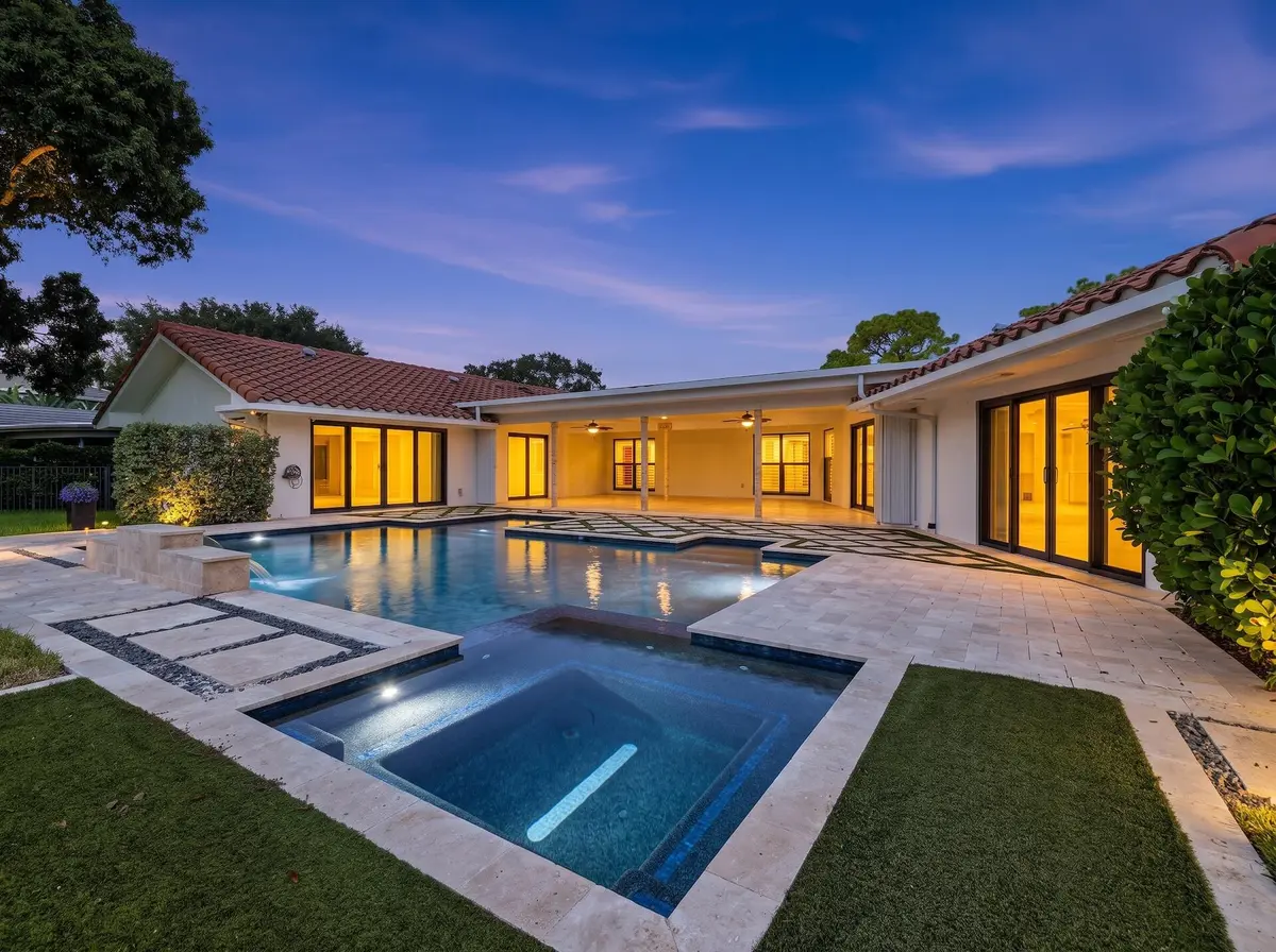 Back Exterior Pool Sunset at 1013 SHADY LAKES Circle, Palm Beach Gardens