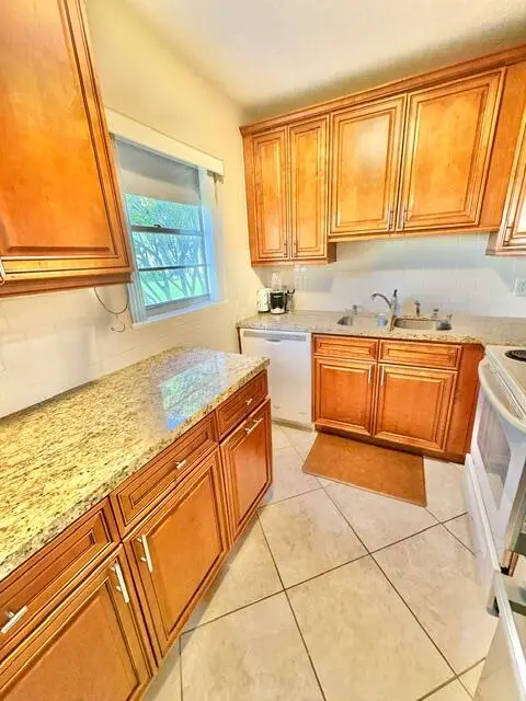 end unit with window in kitchen at 49 Norwich C, West Palm Beach
