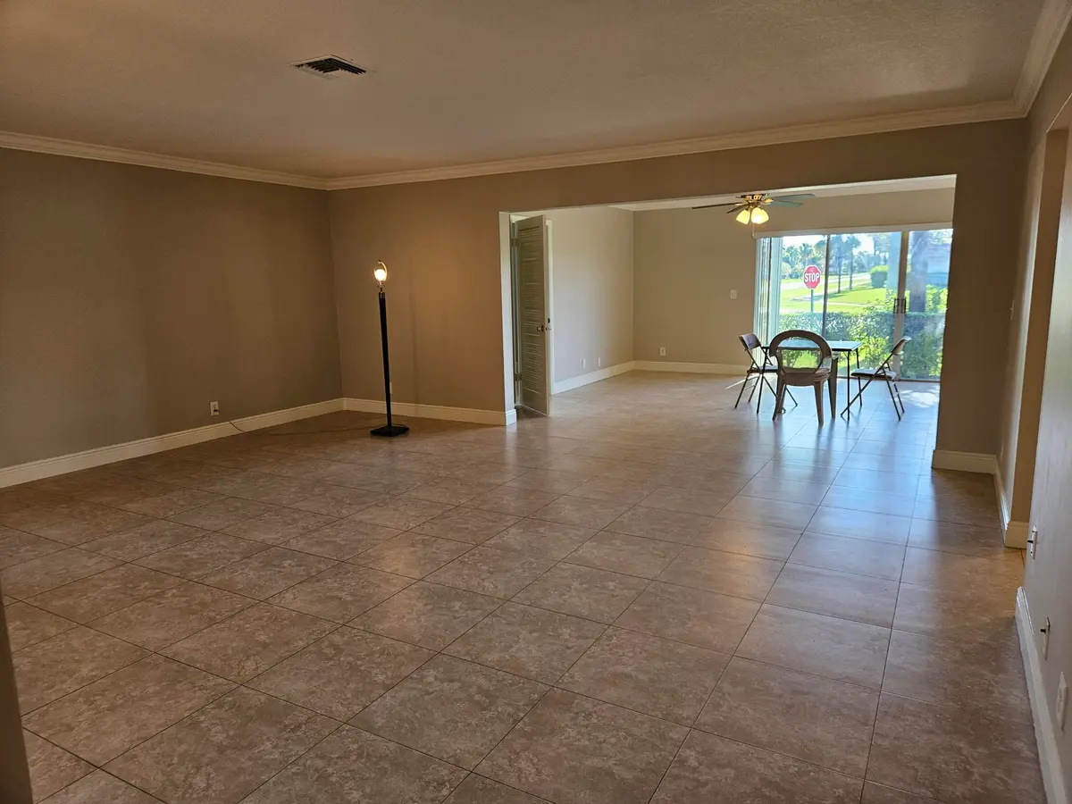 Living room facing family room at 2886 Fernley Drive 1, West Palm Beach