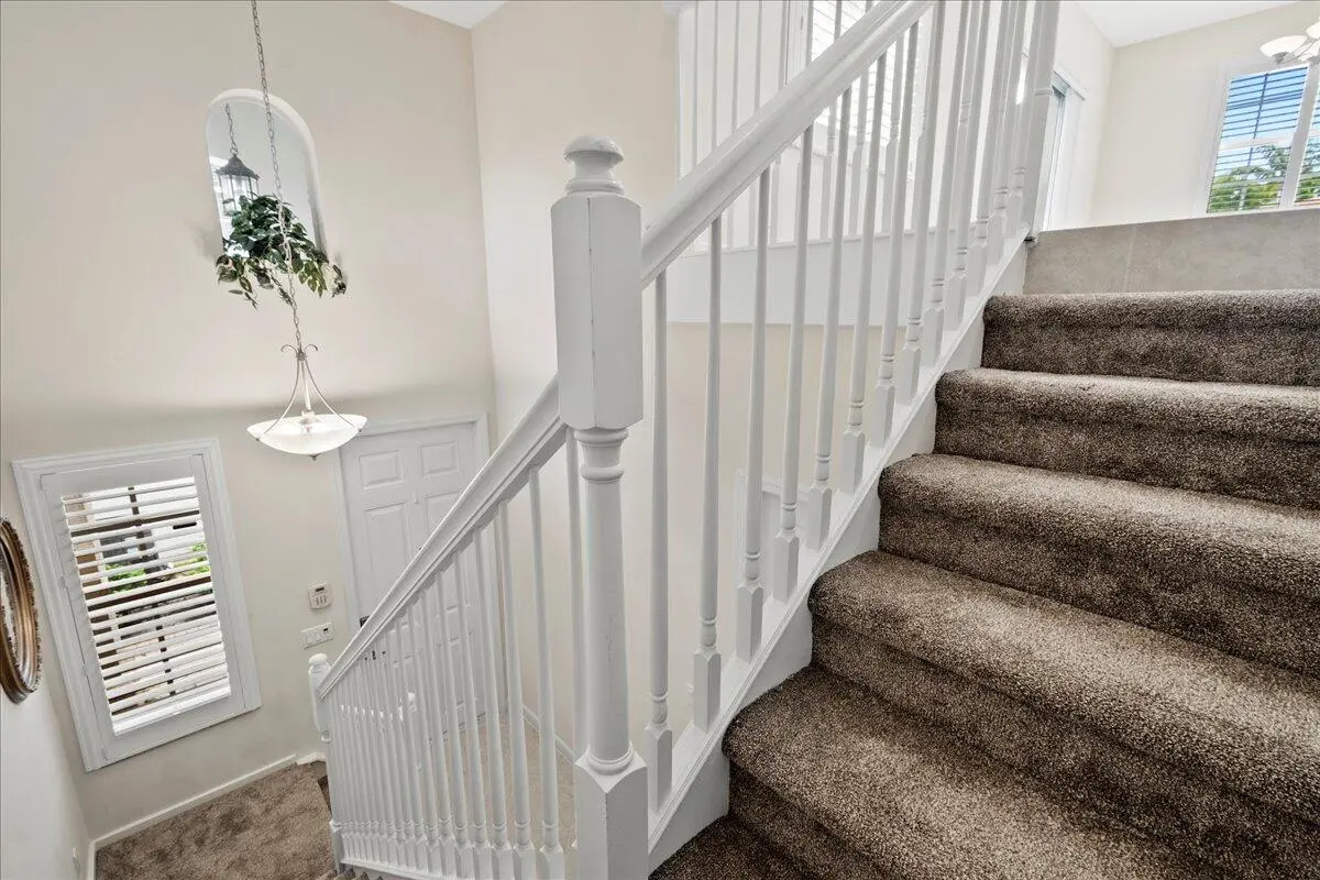 Staircase to Living Area at 107 Evergrene Parkway, Palm Beach Gardens