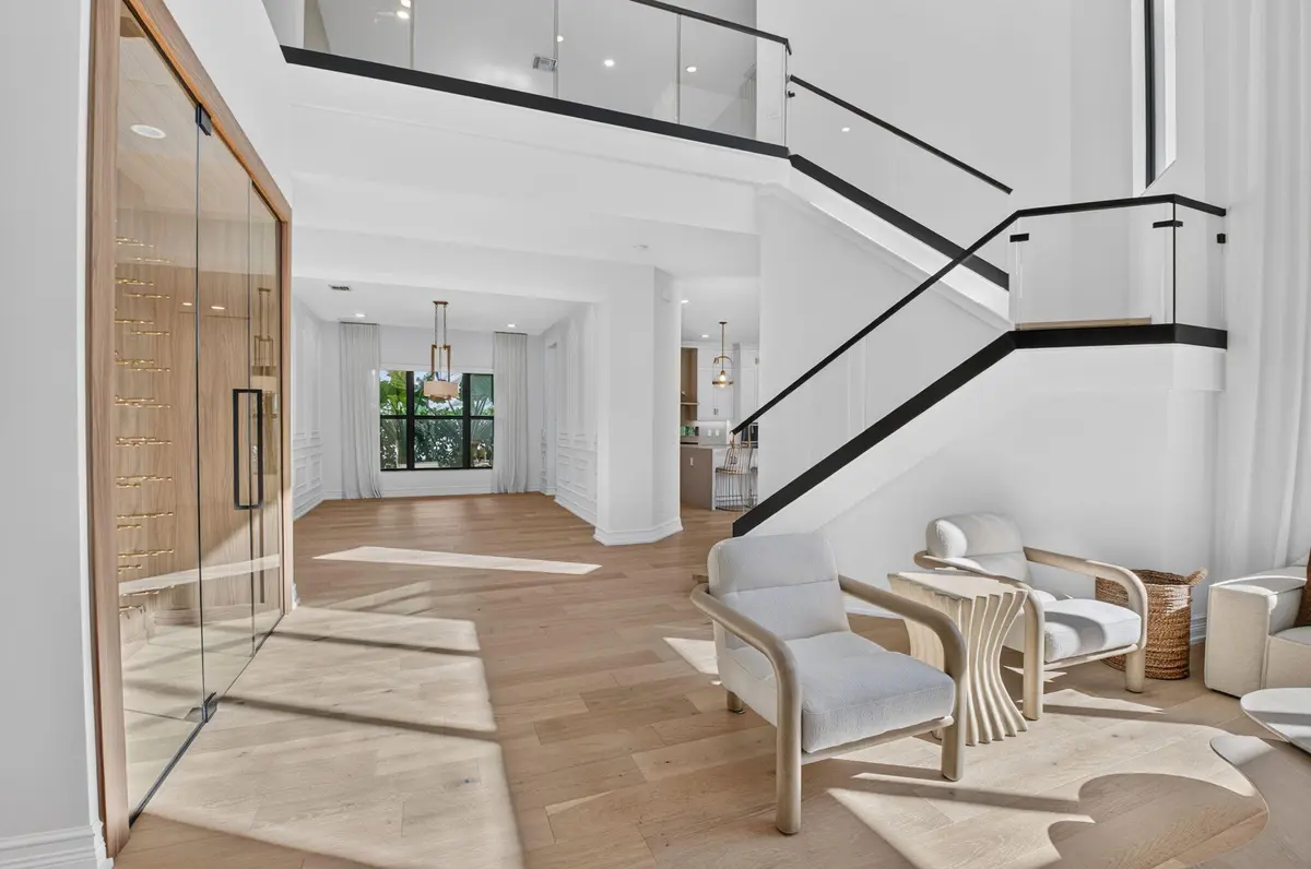 Glass Framed Staircase at 17400 Ponte Chiasso Drive, Boca Raton