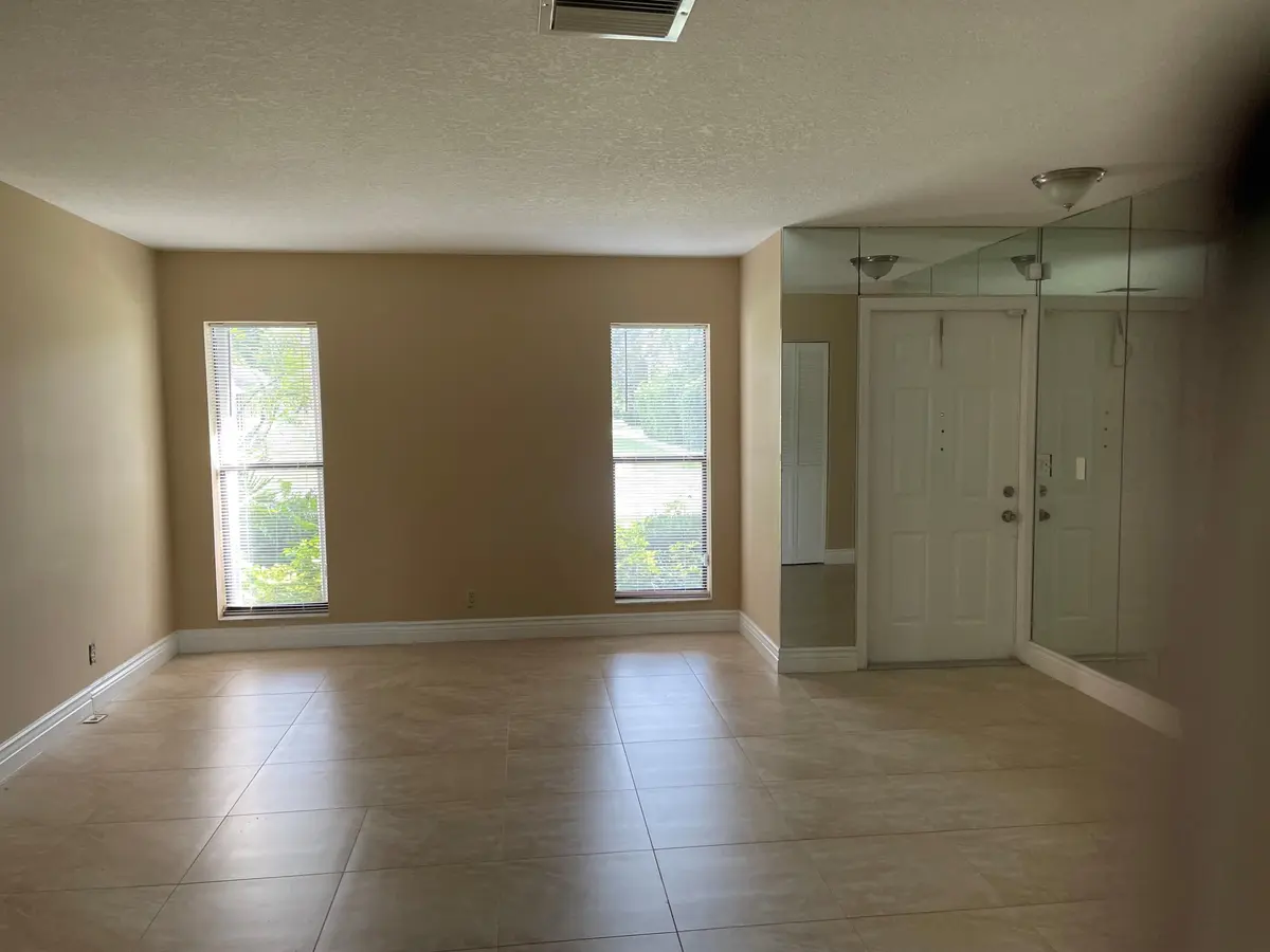tim living room front door view!!! at 6347 Timberlakes Way, Delray Beach