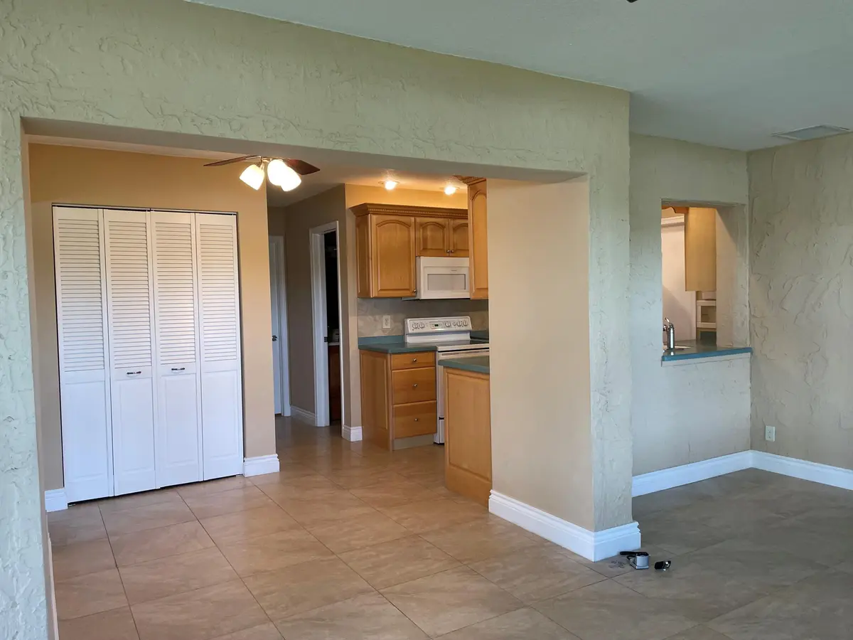 tim view into pantry and kitchen at 6347 Timberlakes Way, Delray Beach
