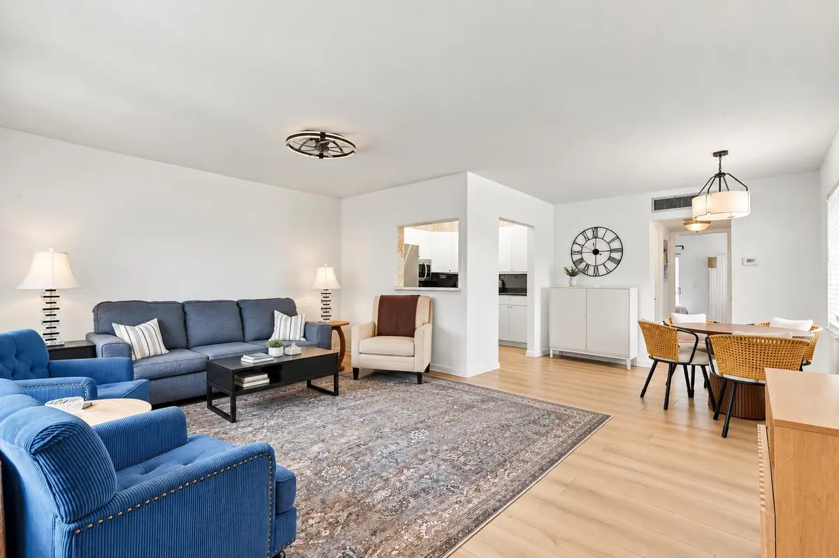 Modern Open-Plan Living and Dining Room at 80 NORWICH D, West Palm Beach