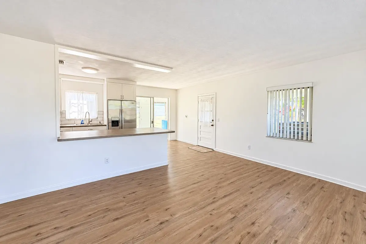 Bright Empty Open-Plan Kitchen and Livin at 116 NE ENTRADA Avenue, Port St. Lucie