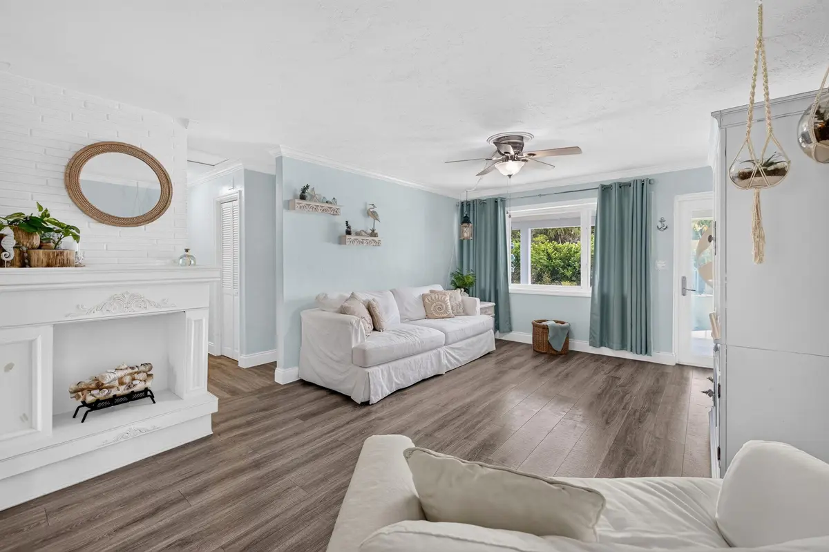 Living room with decorative fireplace at 1131 NE 3rd Street, Pompano Beach