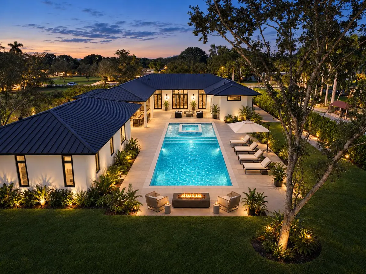 Twilight pool, spa, and firepit at 18200 SW 50 Court, Southwest Ranches