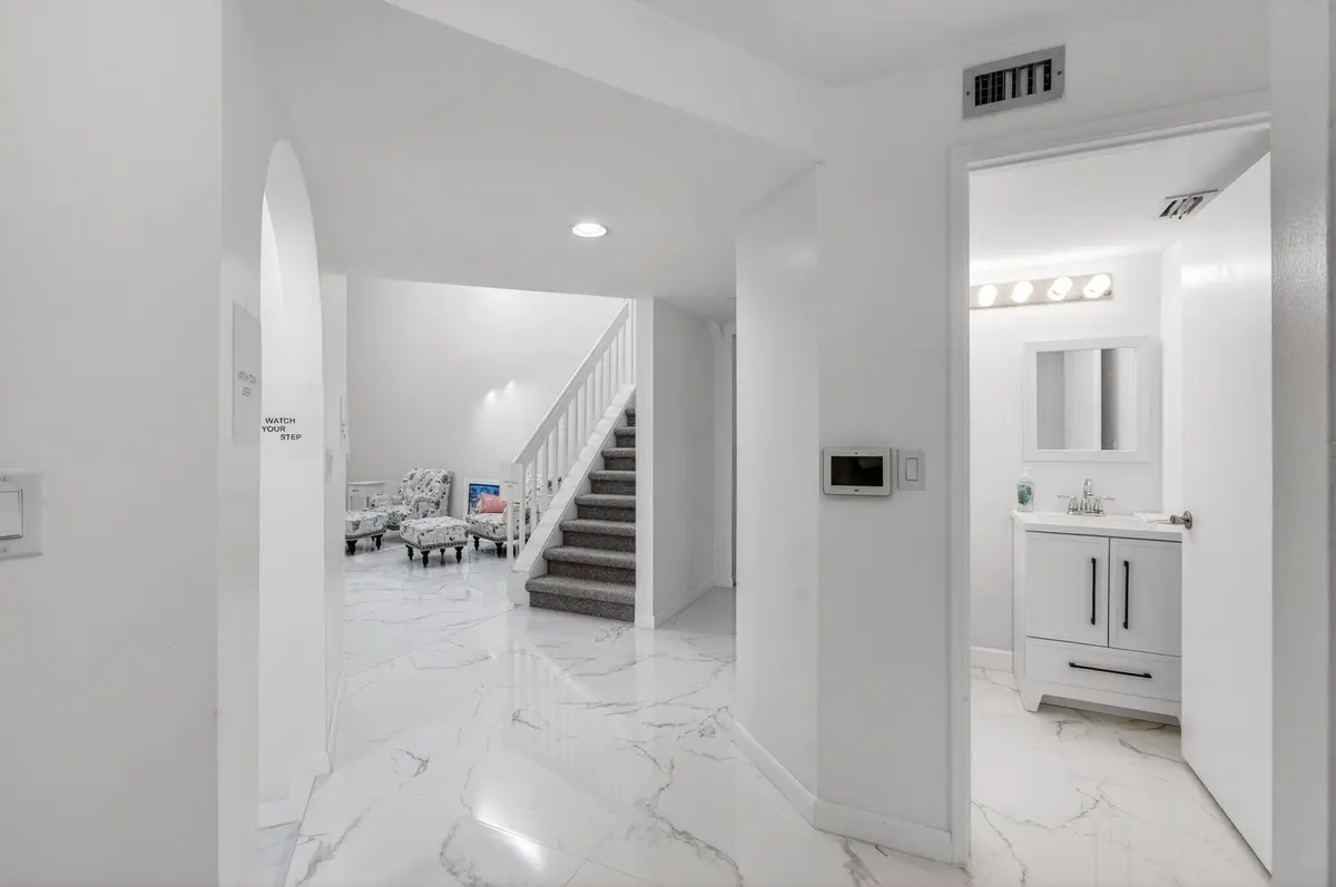 Foyer entry and half bath at 7865 LA MIRADA Drive, Boca Raton