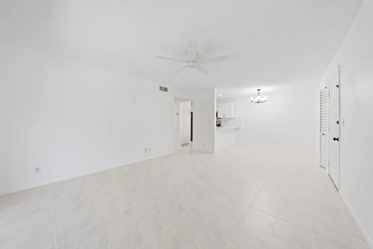 3402 Gardens E Dr Living to Kitchen at 3402 Gardens E Drive, Palm Beach Gardens