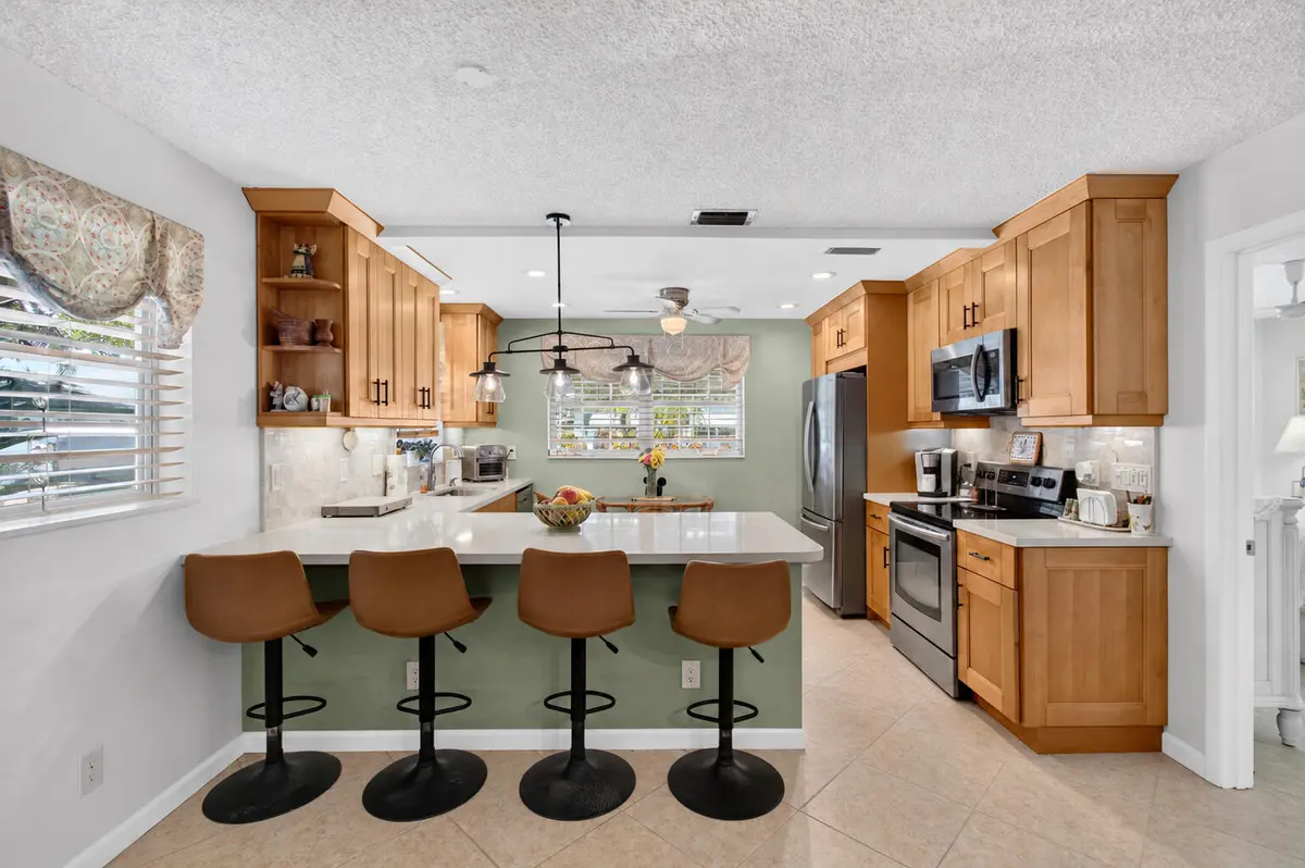 02_kitchen_and_breakfast_bar_DSC_9129 at 842 Meadowlark Lane, Delray Beach