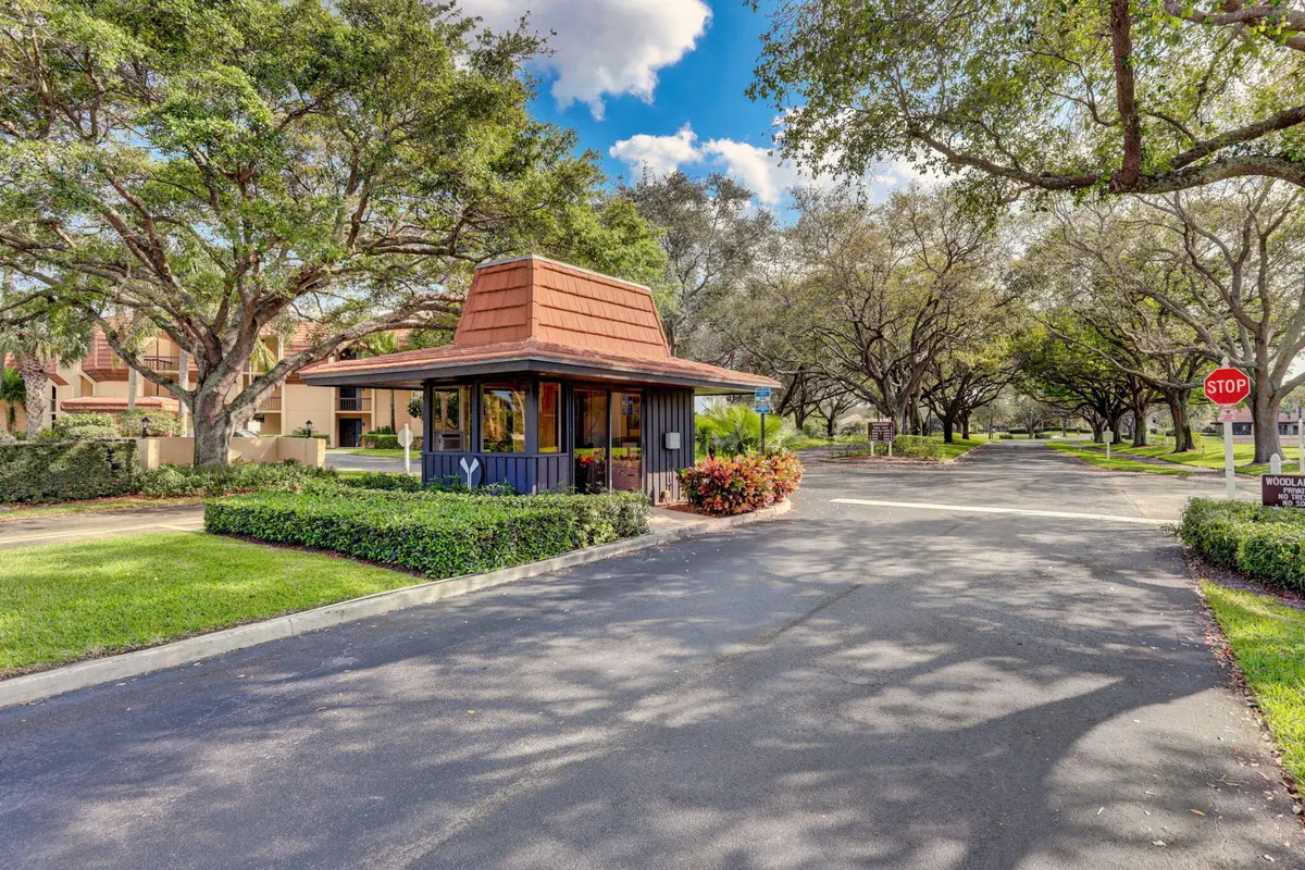 92-web-or-mls-WL - Entrance at 5344 WOODLAND LAKES Drive 225, Palm Beach Gardens