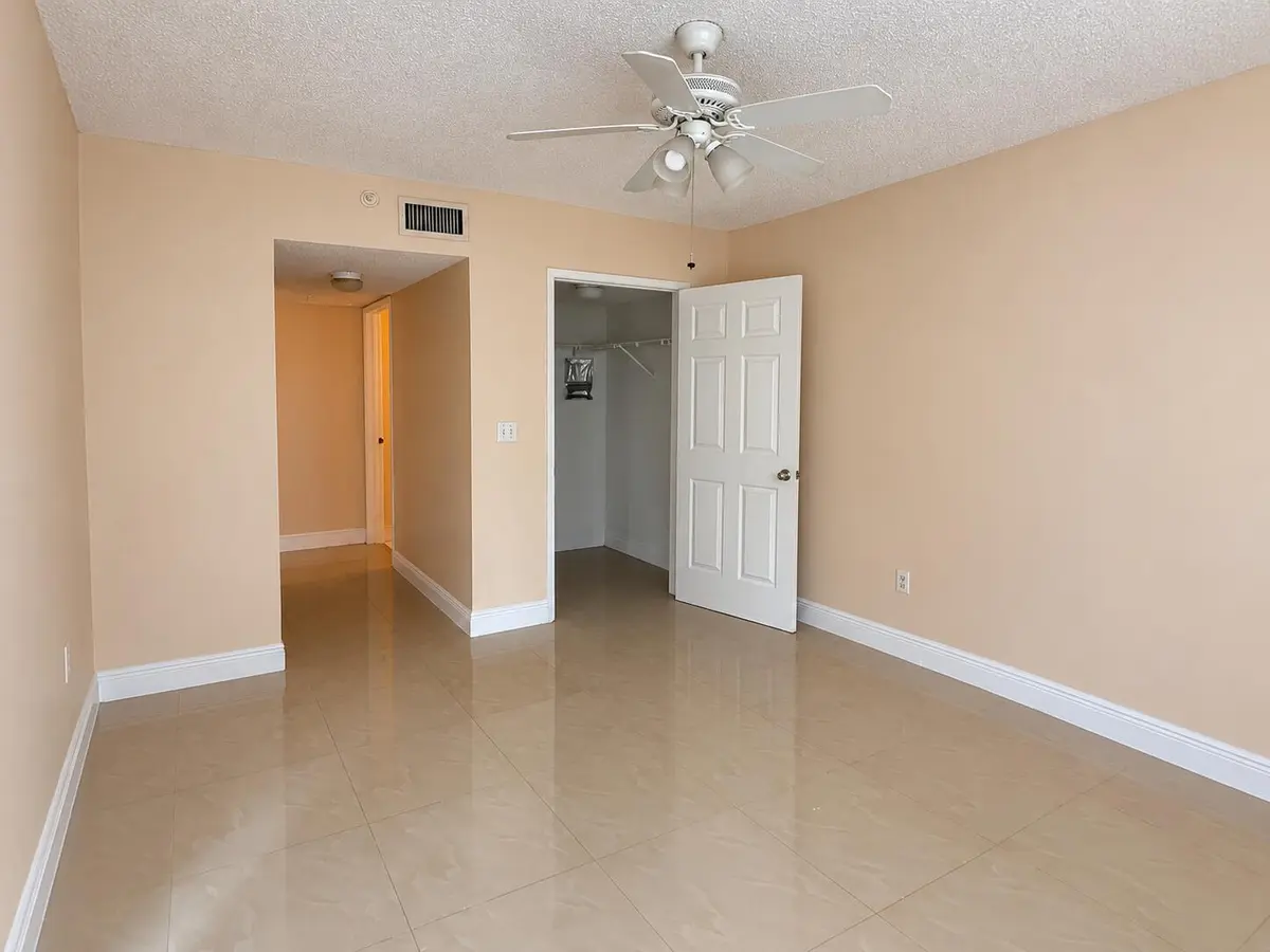 Empty Beige Room with Open Closet and Ce at 2620 S UNIVERSITY Drive 311, Davie
