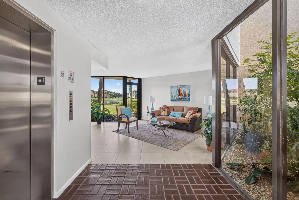 5-web-or-mls-WL - Lobby 1 at 5344 WOODLAND LAKES Drive 225, Palm Beach Gardens