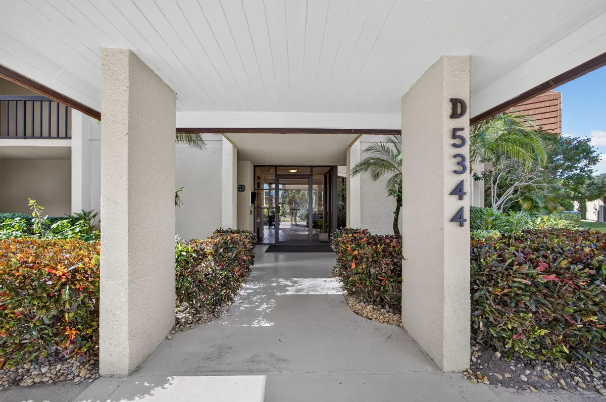 3-web-or-mls-WL - Exterior Entrance 1 at 5344 WOODLAND LAKES Drive 225, Palm Beach Gardens