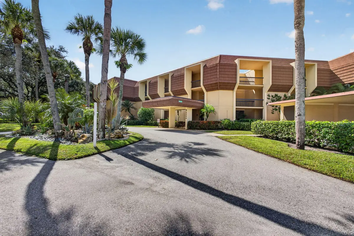 1-web-or-mls-WL - Front Exterior 1 at 5344 WOODLAND LAKES Drive 225, Palm Beach Gardens