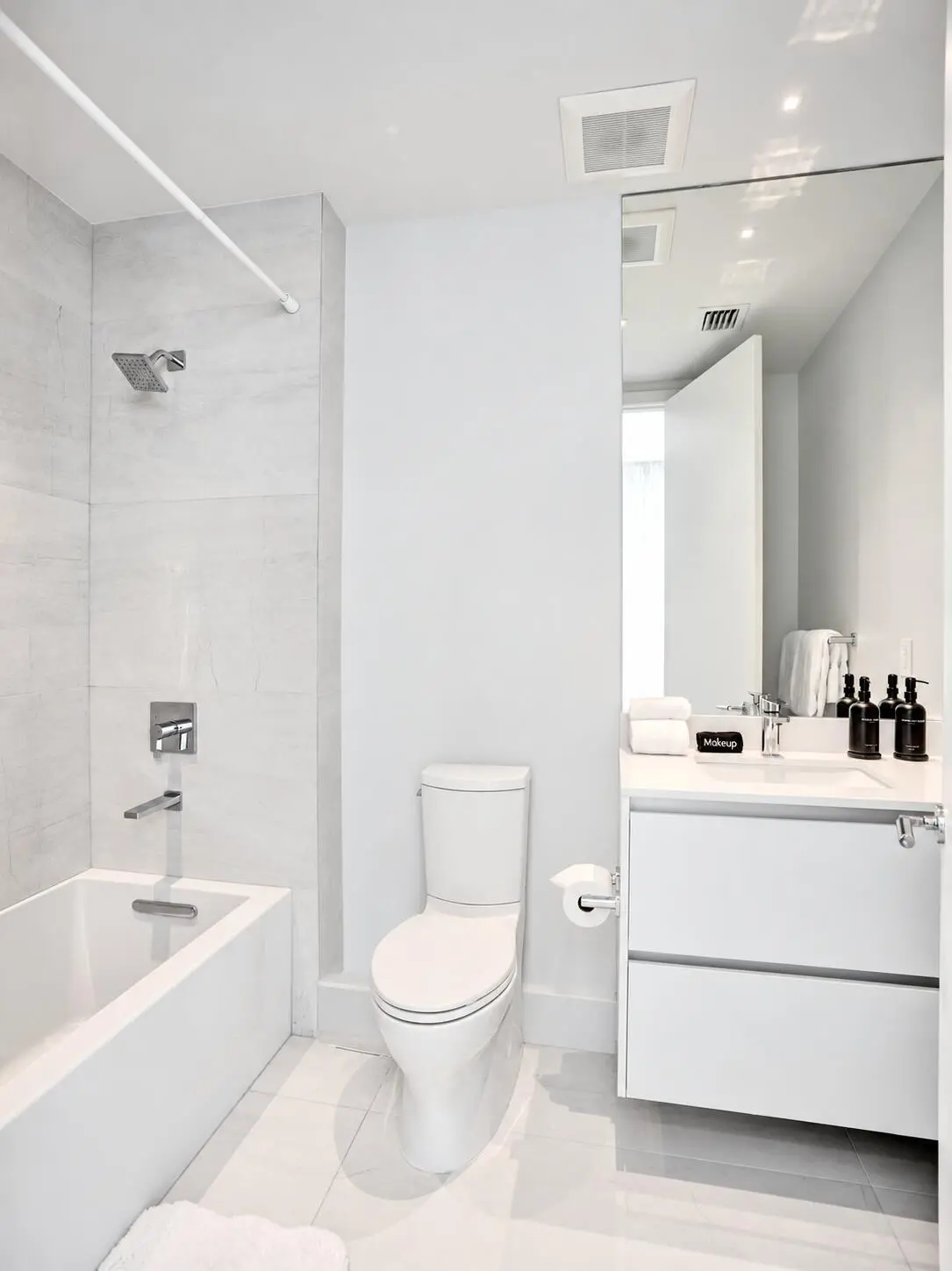 Bright Minimalist White Bathroom at 305 BRINY Avenue 401, Pompano Beach