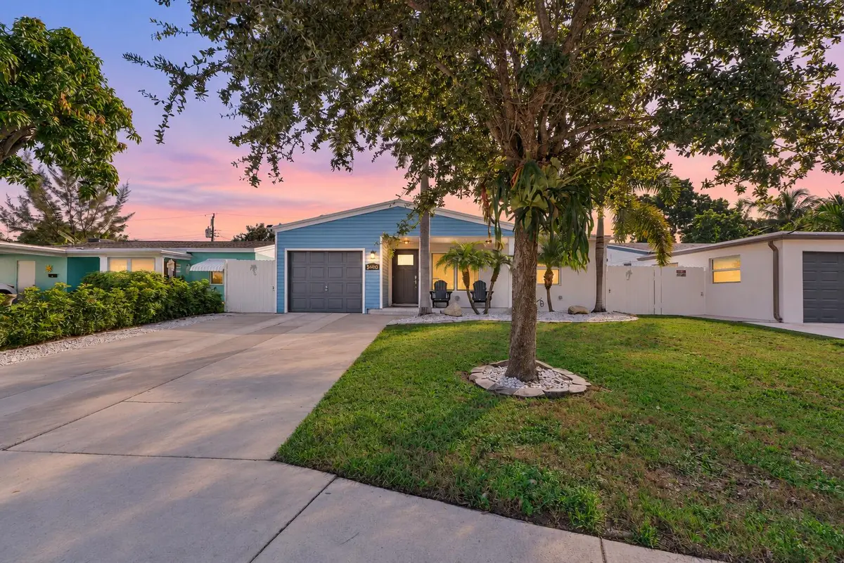 Bright twilight blue house at 5400 NE 4TH Terrace, Oakland Park