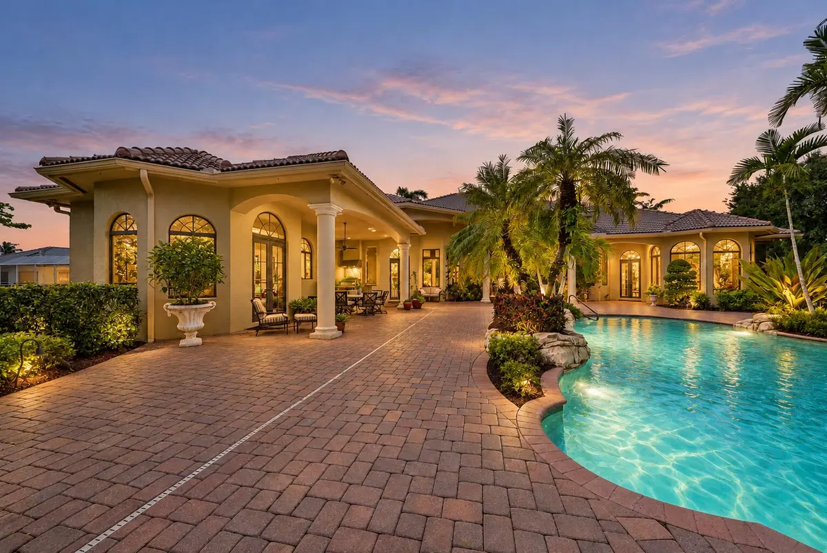 Pool with Warm Landscape Lighting at 7730 Woodsmuir Drive, West Palm Beach