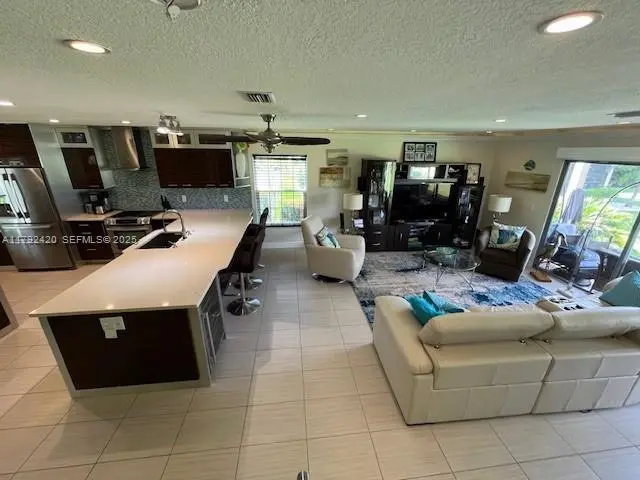 Spacious Living room with water view - C at 9130 SE RIVERFRONT Terrace I, Jupiter