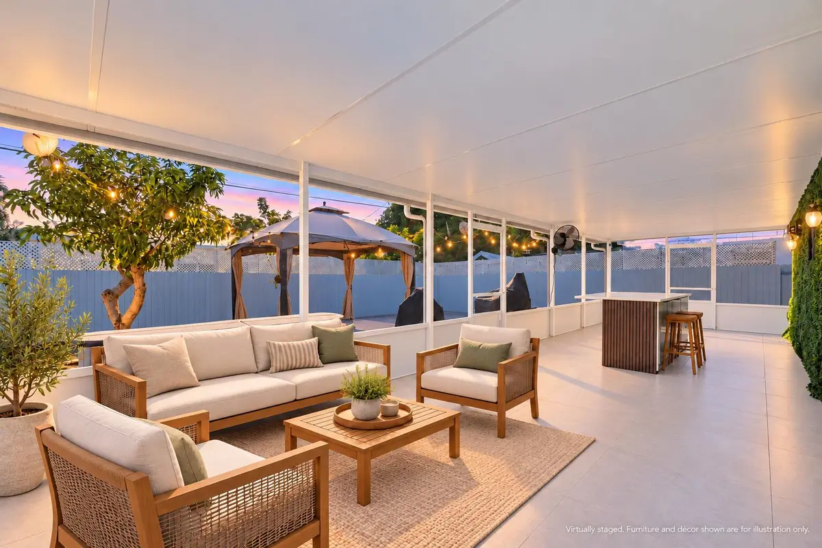 Brighter twilight screened patio at 5400 NE 4TH Terrace, Oakland Park