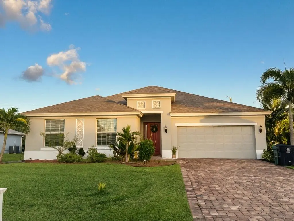 AJ front of house at 4437 SW Farmington Street, Port St. Lucie