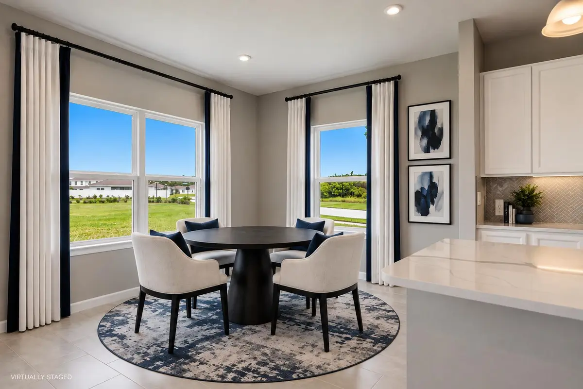 Virtually Staged Navy-Accented Breakfast at 6555 POMELLO Court, Vero Beach