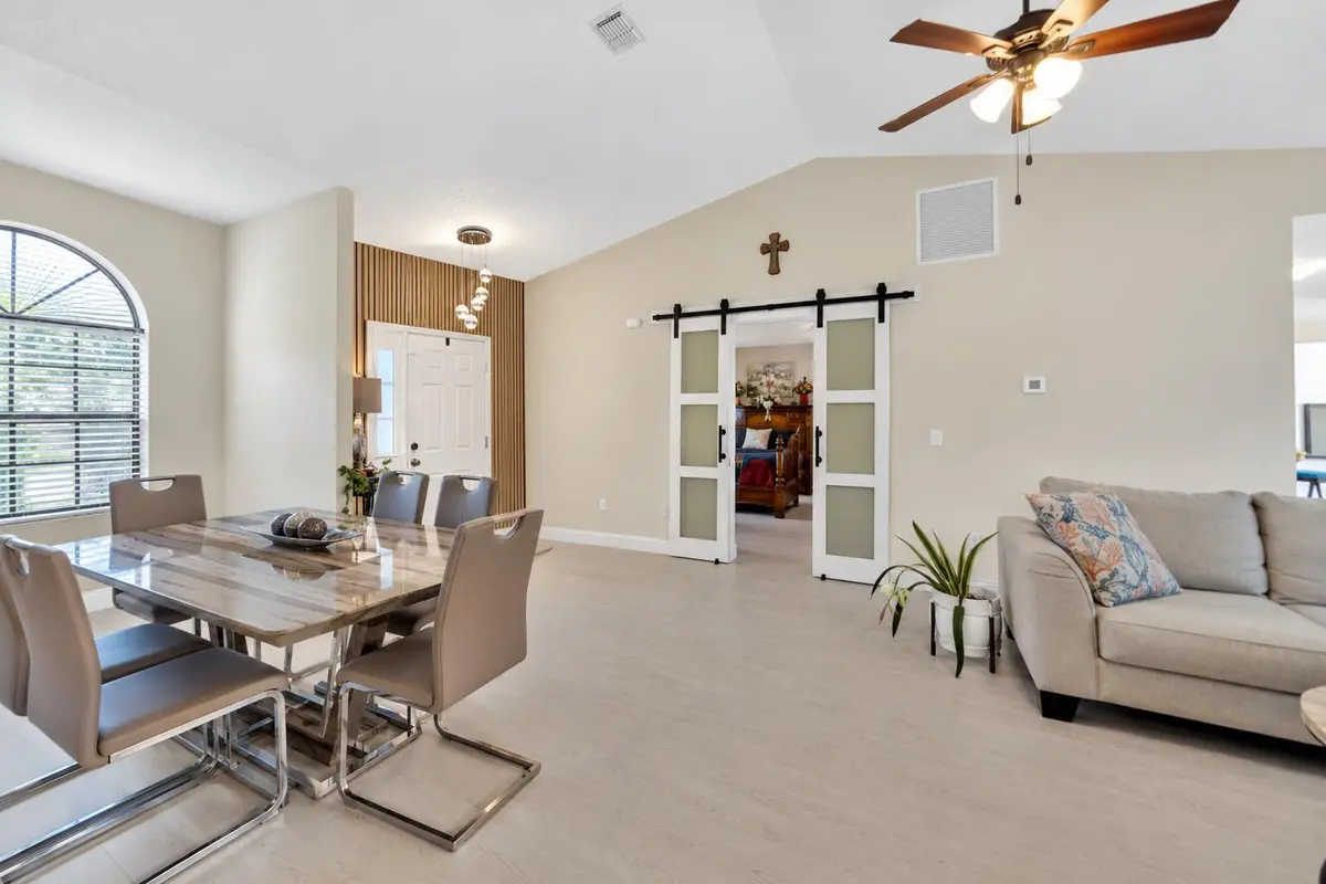Modern Entryway with Wood Slat Accent Wa at 2268 SE LONGHORN Avenue, Port St. Lucie