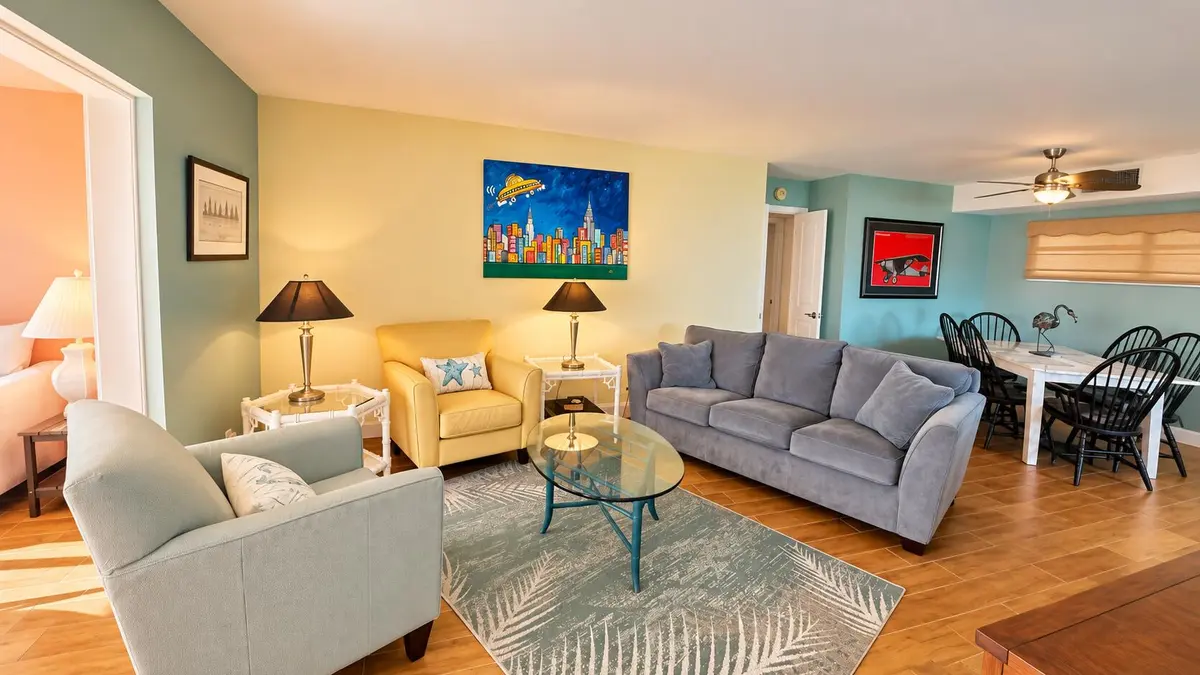 Sunlit living room with warm lamps at 2 COLONIAL CLUB Drive 101, Boynton Beach