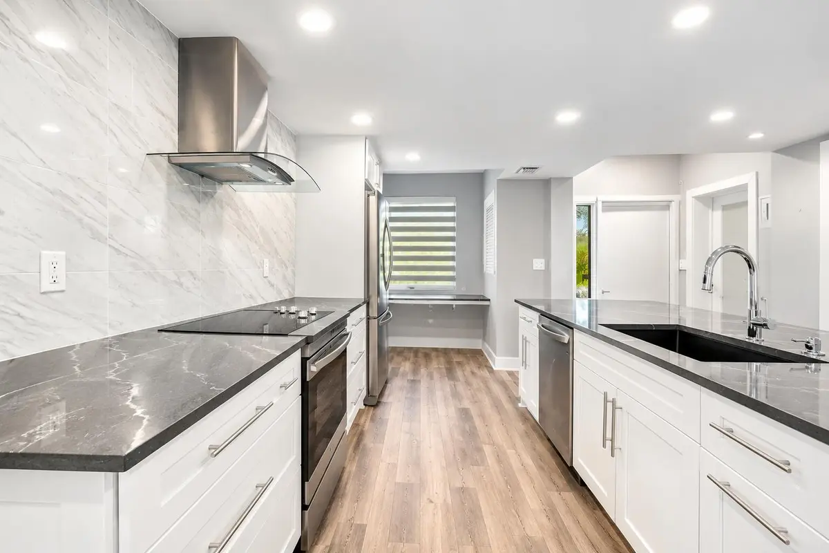 Modern Luxury Galley Kitchen at 730 GREENSWARD Court 108-J, Delray Beach