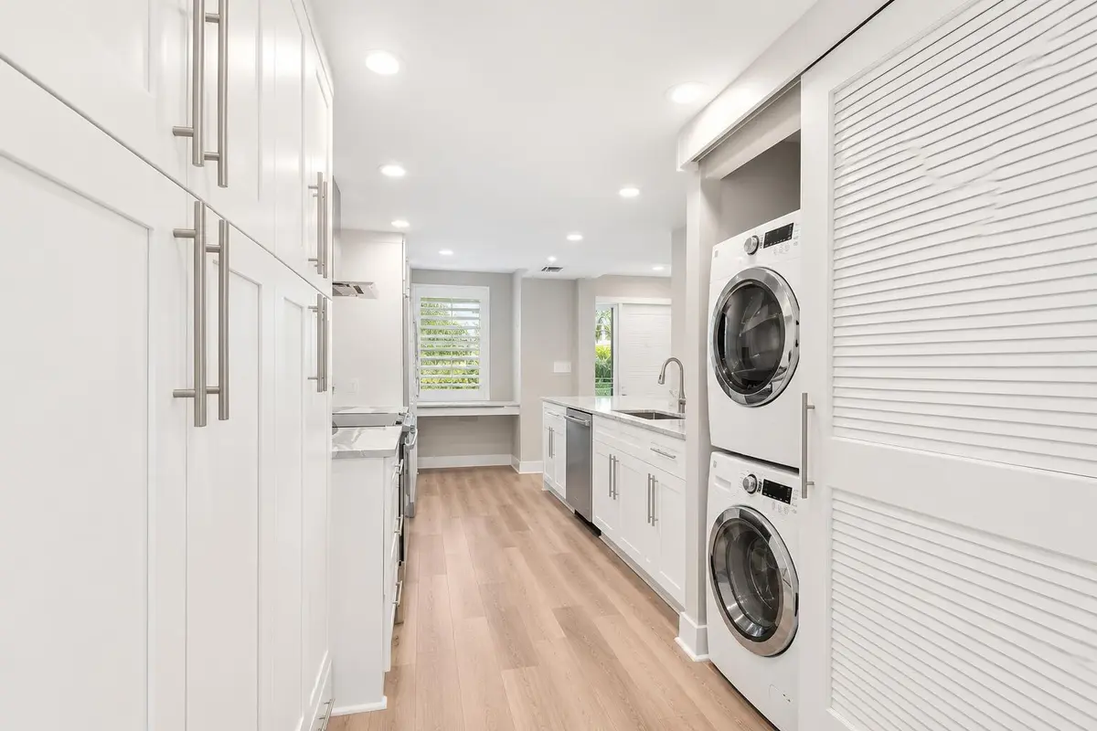 Bright Minimalist Laundry Galley with Bu at 730 GREENSWARD Court 108-J, Delray Beach