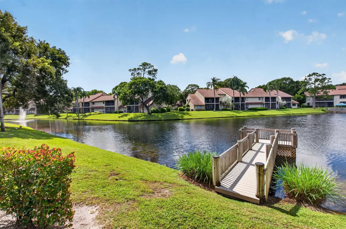 FOUNTAIN, LAKE AND DOCK VIEWS at 5621 Coach House Circle, Boca Raton